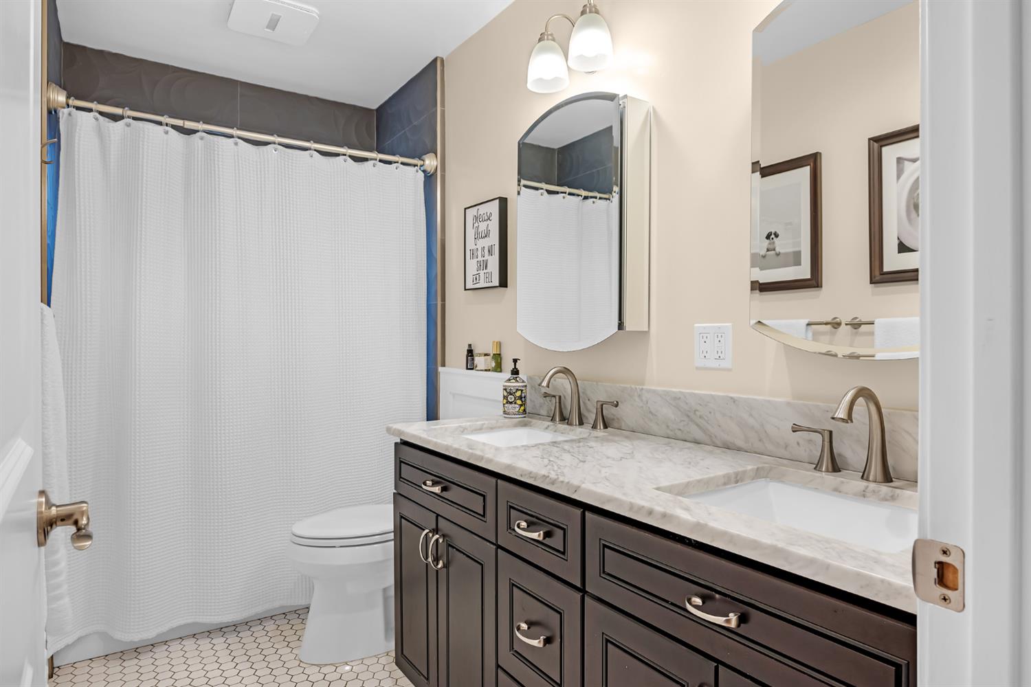 5220 Shelato Way Carmichael, CA 95608 - Photo 25 of 40 a bathroom with a granite countertop sink a toilet and a mirror