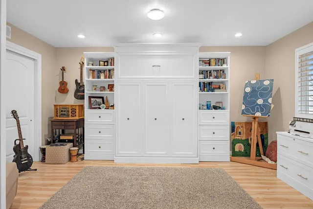 walk in closet with clothes