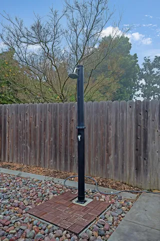 a view of a entrance gate with wooden fence
