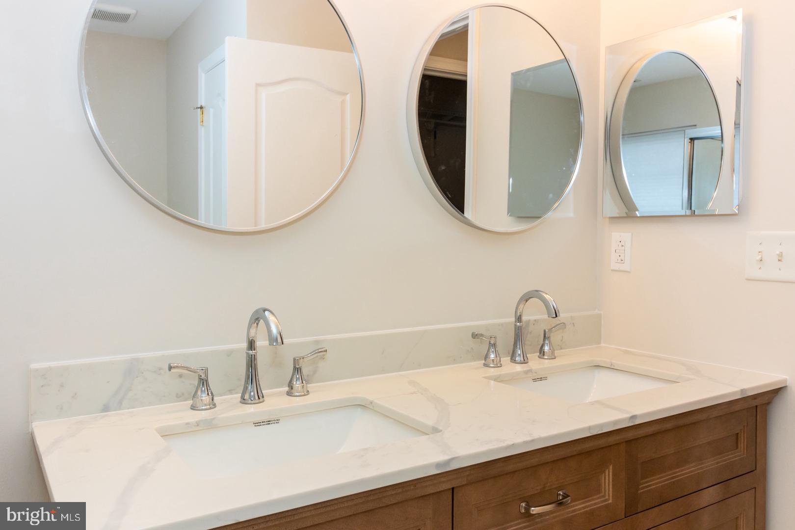 226 Hawthorne Way Riverside, NJ 08075 - Photo 21 of 32 a bathroom with a double vanity sink and a mirror