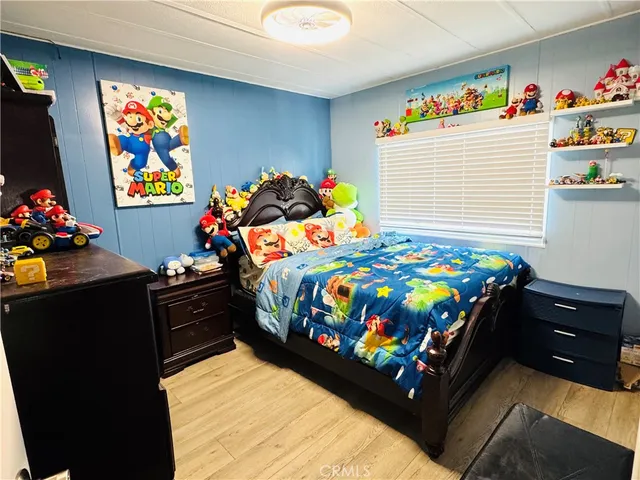 a bedroom with a bed and a couch in it