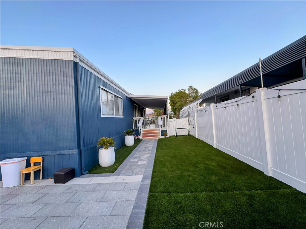26245 East Baseline Street, Unit 18 Highland, CA 92346 - Photo 17 of 25 a backyard of a house with seating space