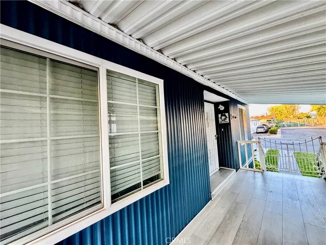 a view of a balcony with wooden floor