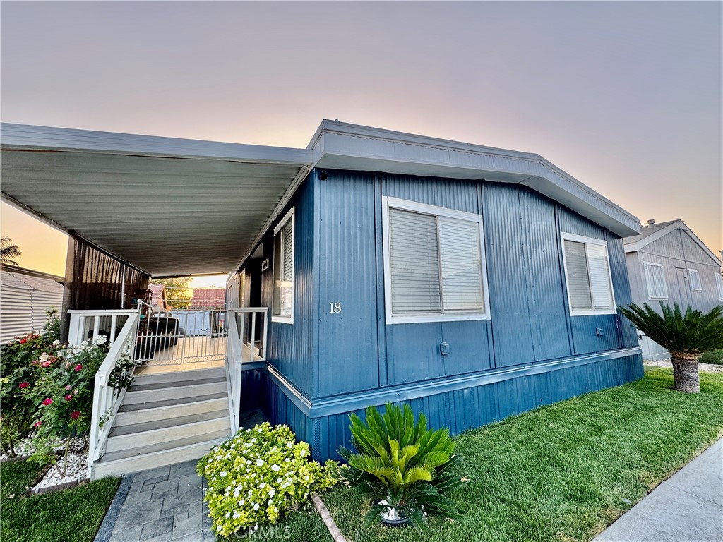 26245 East Baseline Street, Unit 18 Highland, CA 92346 - Photo 23 of 25 a house view with a garden space