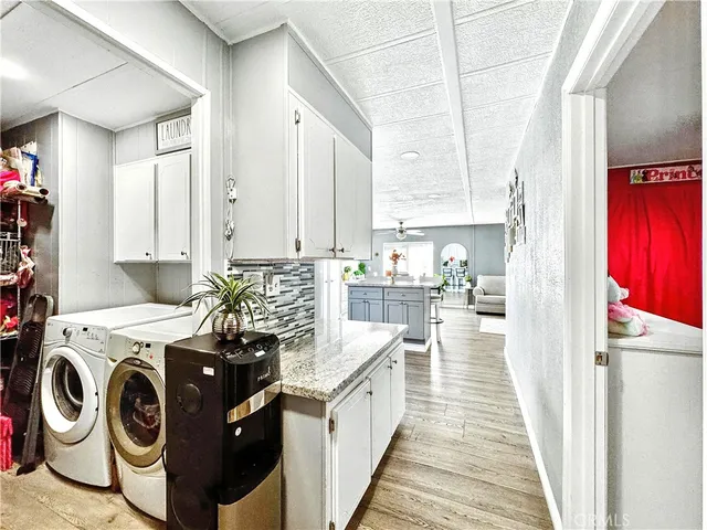 a kitchen with a stove top oven sink and cabinets