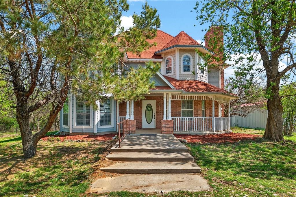 514 Garza Road Shady Shores, TX 76208 - Photo 1 of 1 a front view of a house with a garden