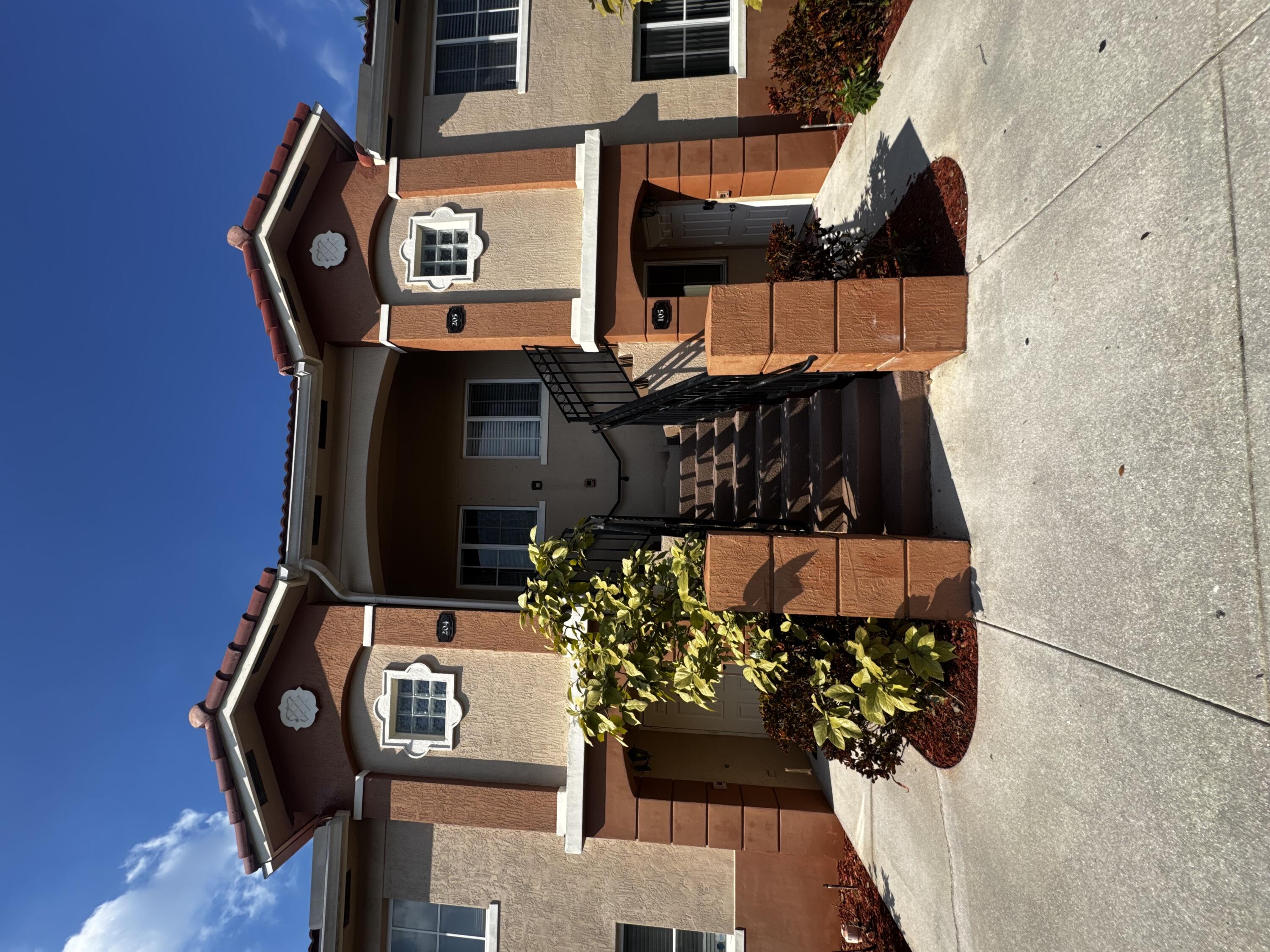 a front view of a house with parking