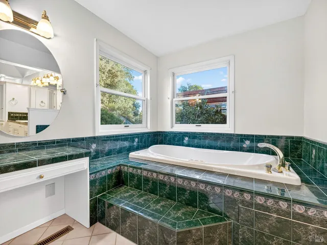 a kitchen with stainless steel appliances granite countertop a refrigerator a stove top oven a sink and dishwasher