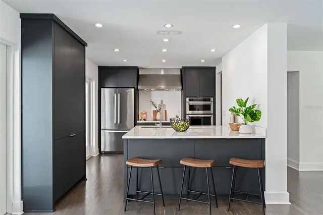 a kitchen with a table and chairs in it