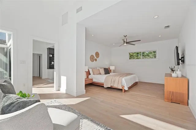 a bedroom with furniture and a couch