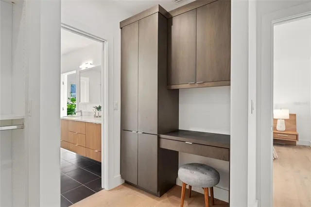 a bathroom with a shower a sink and a mirror
