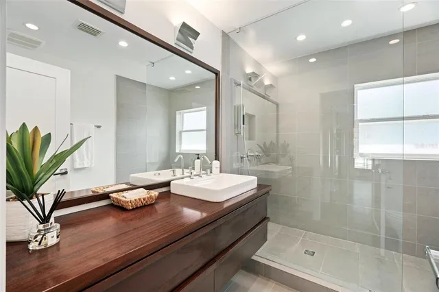 a front view of house with yard and trees in the background