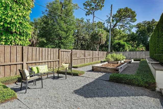 an aerial view of a house with yard