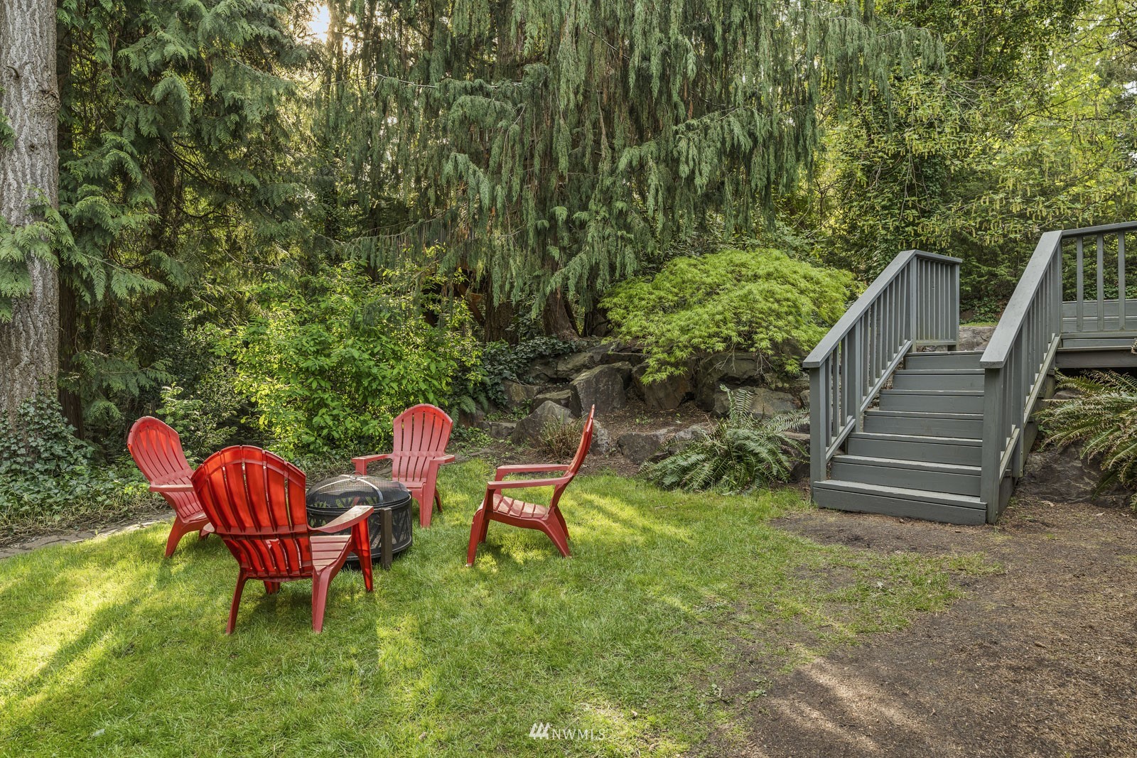 21932 3rd Drive Southeast Bothell, WA 98021 - Photo 31 of 40 a backyard of a house with table and chairs
