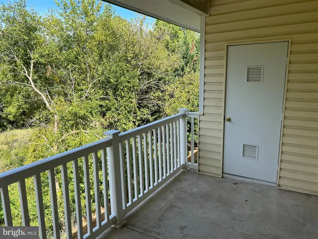 a view of a balcony with stairs
