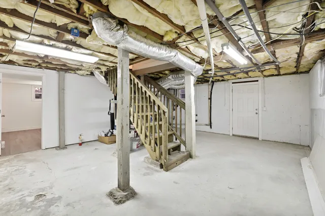 a view of a room with wooden walls