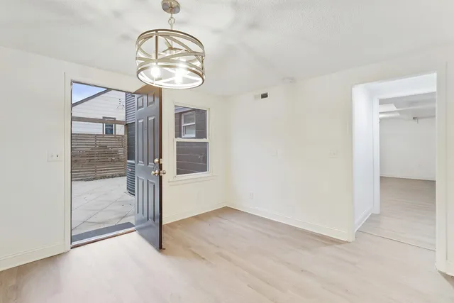 an empty room with a mirror