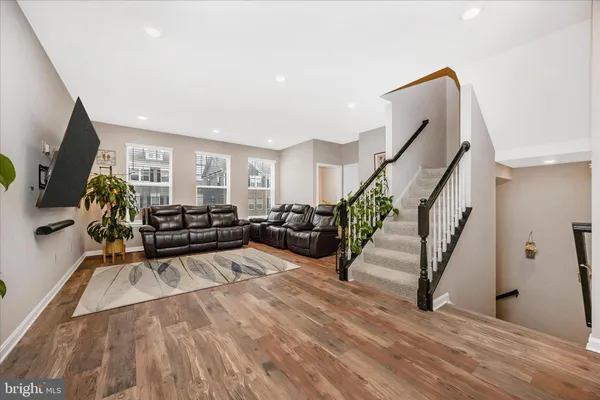 a kitchen with a sink stainless steel appliances cabinets and a counter top space