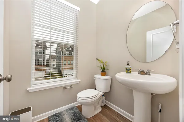 a front view of a residential apartment building with a yard