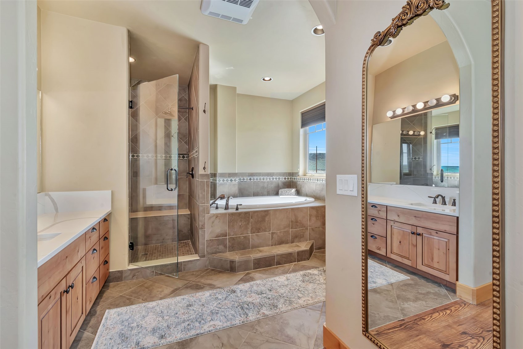 938 South Dry Creek Road Hayden, CO 81639 - Photo 27 of 34 a bathroom with a tub sink and mirror