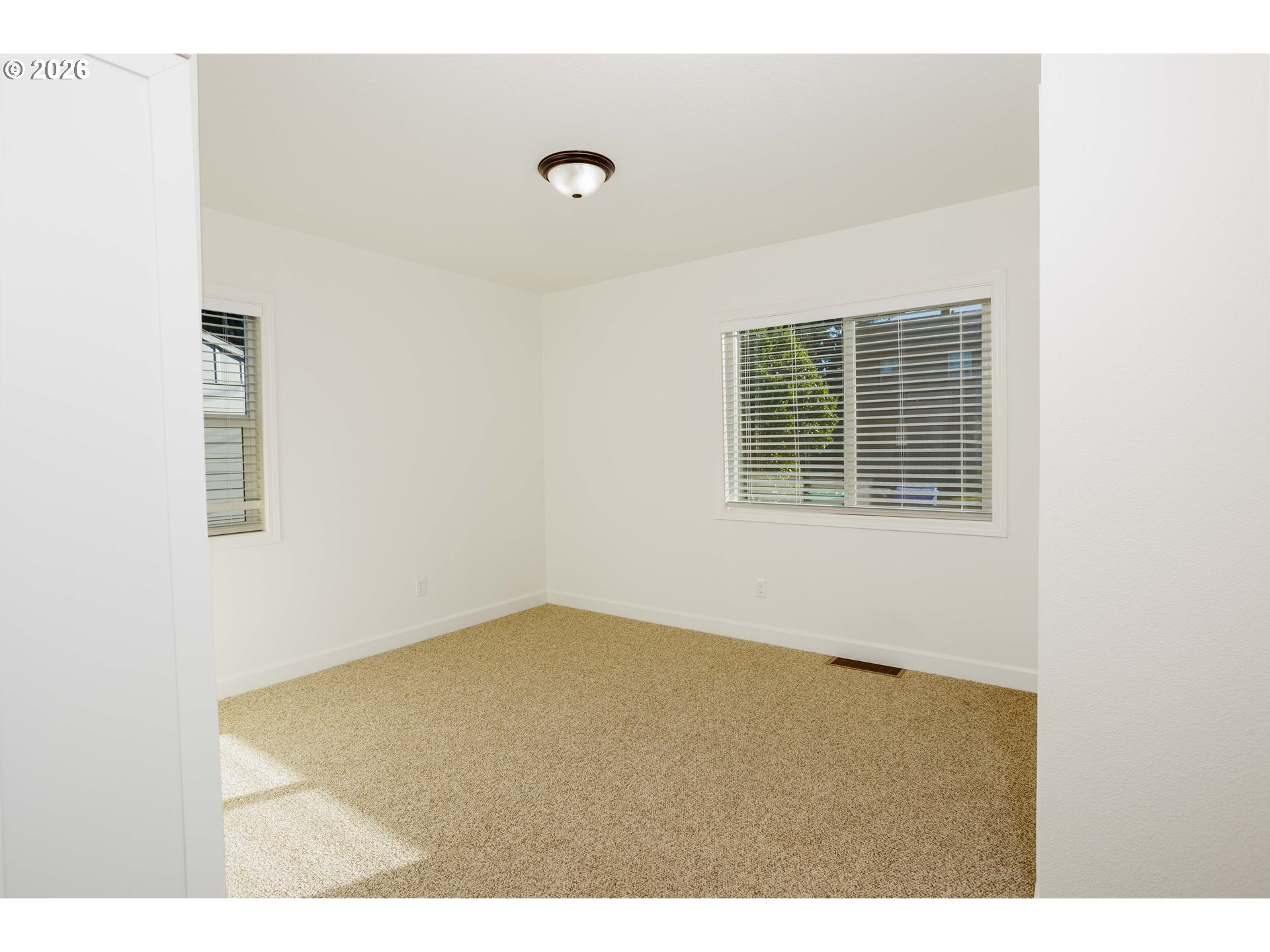 8715 Northeast Clackamas Street Portland, OR 97220 - Photo 11 of 25 a view of an empty room with a window