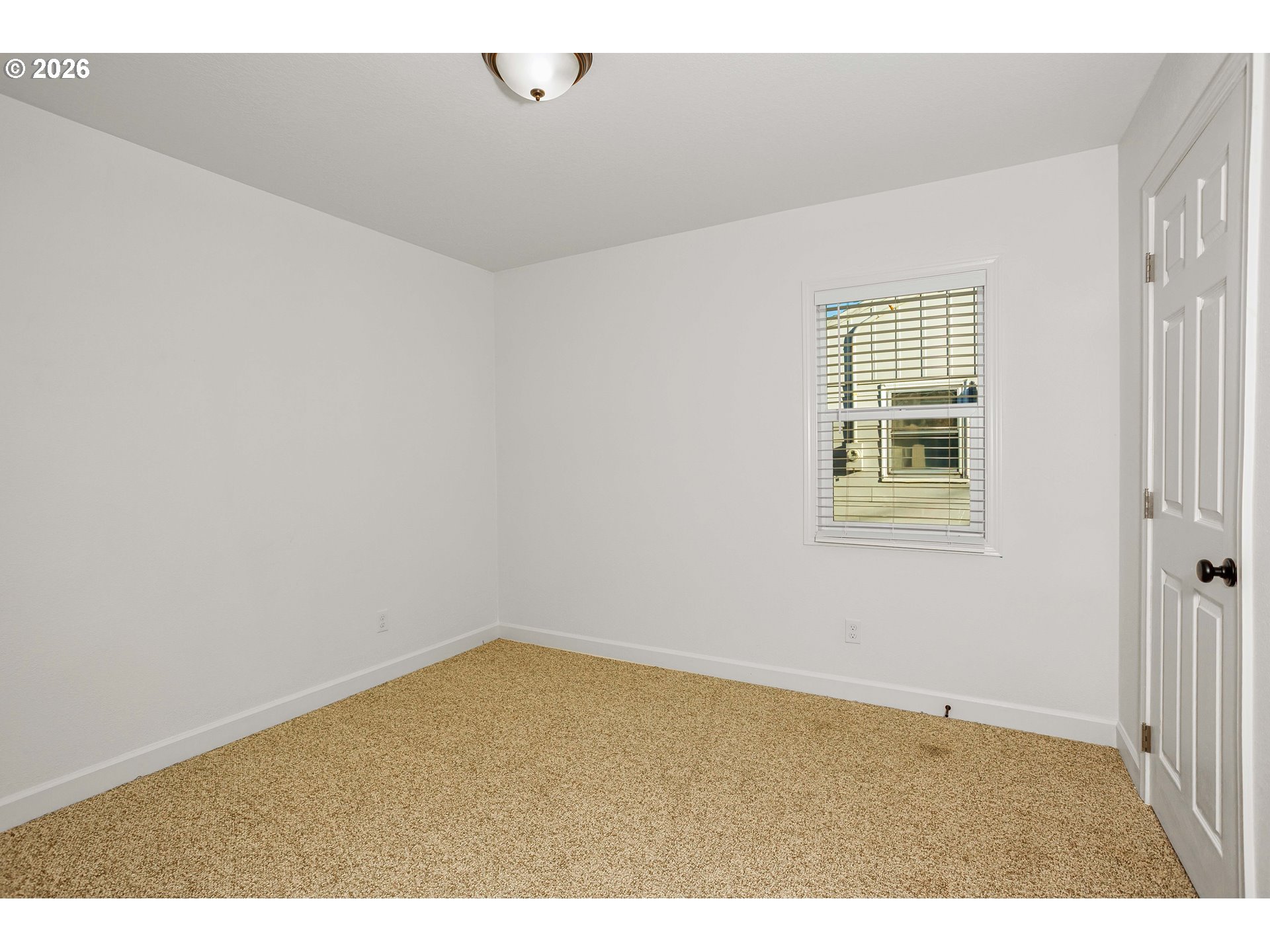 8715 Northeast Clackamas Street Portland, OR 97220 - Photo 13 of 25 an empty room with windows