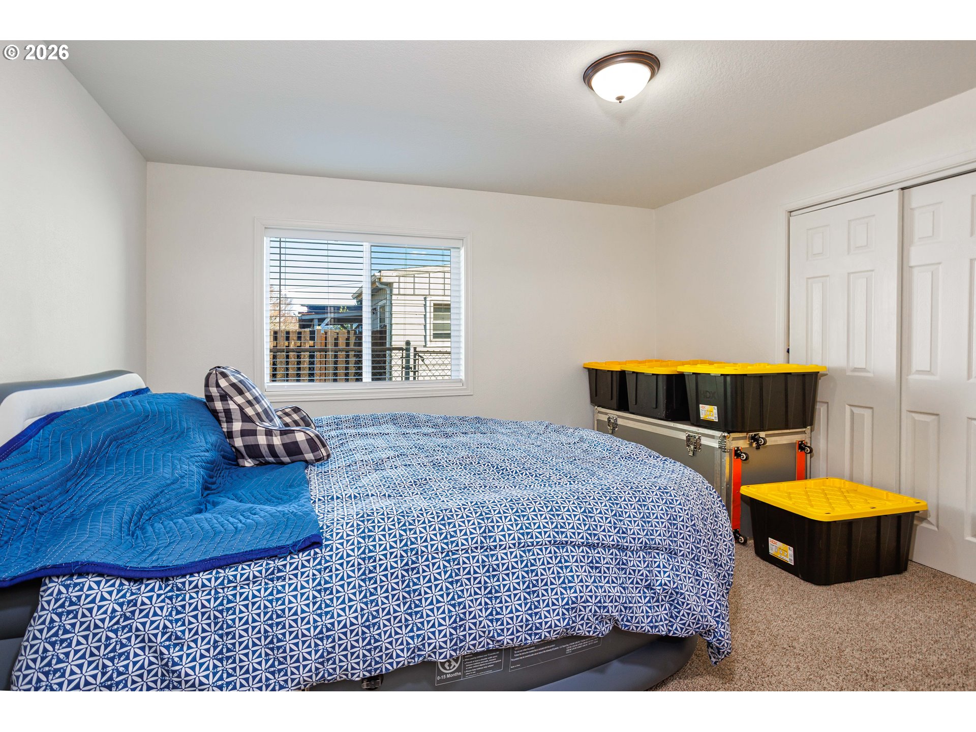 8715 Northeast Clackamas Street Portland, OR 97220 - Photo 15 of 25 a bedroom with a bed and window