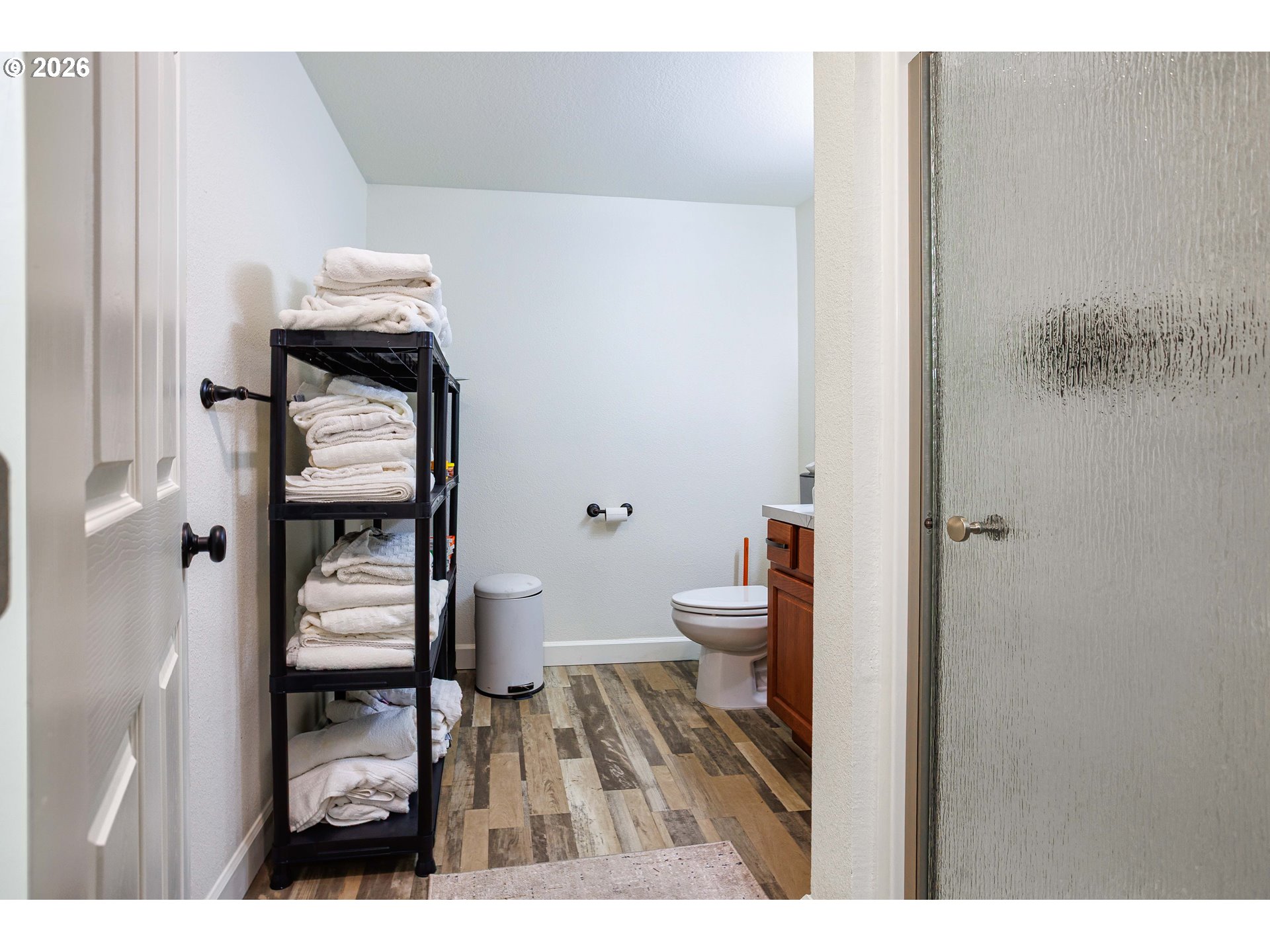 8715 Northeast Clackamas Street Portland, OR 97220 - Photo 22 of 25 a bathroom with a toilet and a mirror