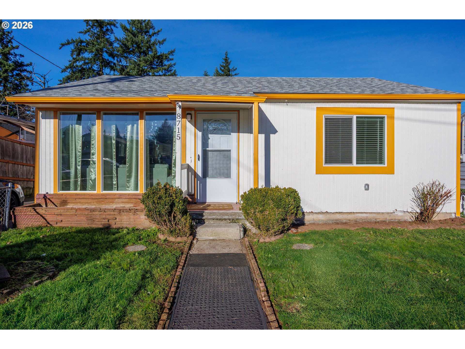 8715 Northeast Clackamas Street Portland, OR 97220 - Photo 3 of 25 a view of a house with a backyard porch and sitting area