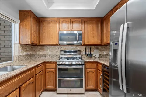 a kitchen with a stove microwave and refrigerator