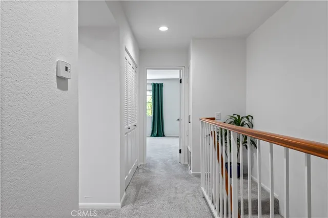 a view of a hallway view with staircase