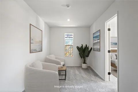 a view of livingroom with furniture and a potted plant