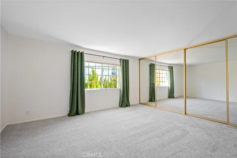 a view of an empty room with glass door