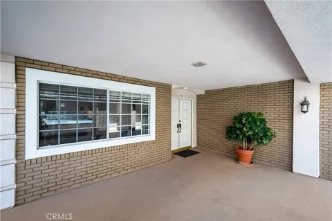 a view of an empty room with a potted plant
