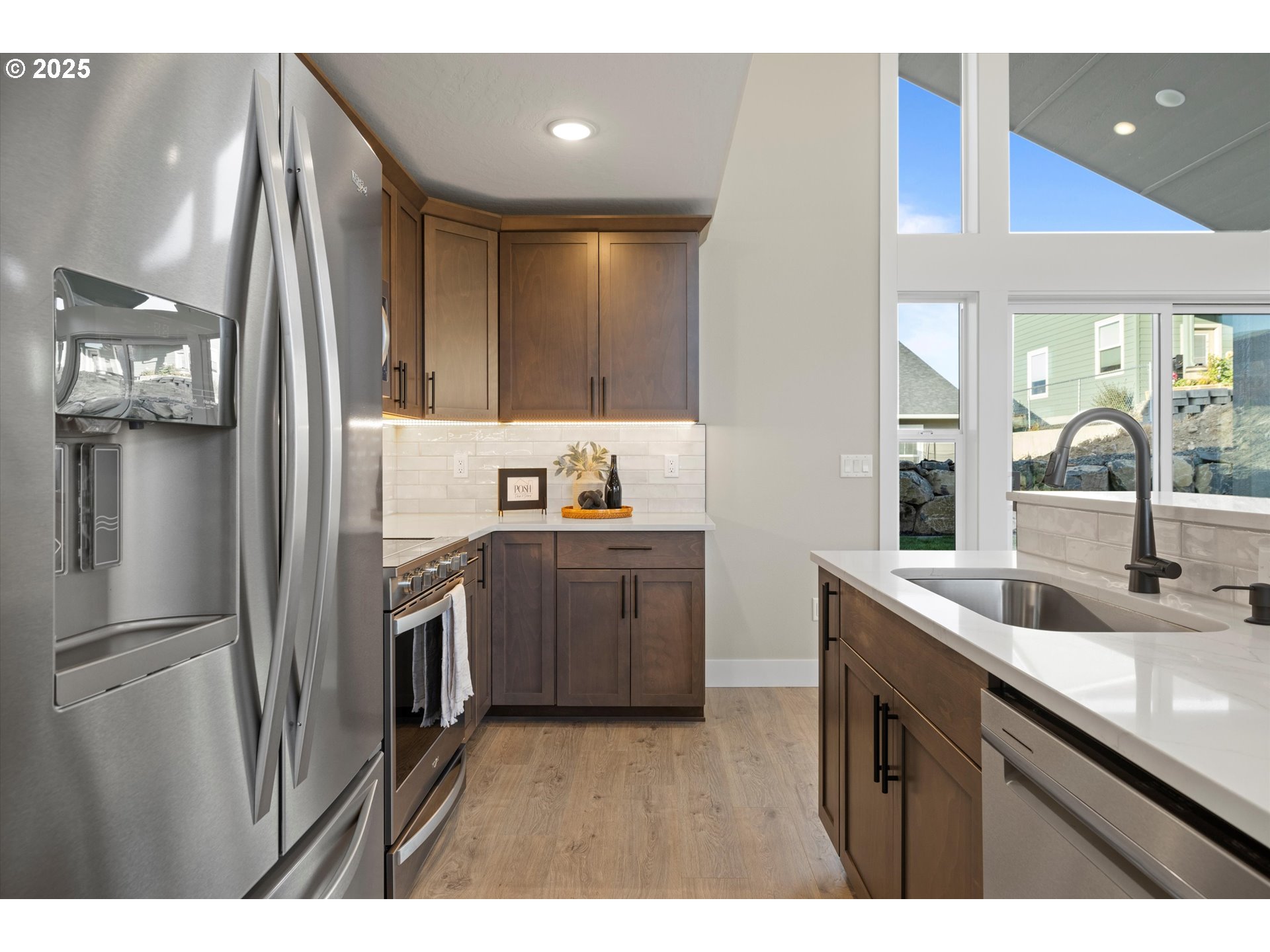 1801 Southwest 1st Street Pendleton, OR 97801 - Photo 13 of 29 a kitchen with a sink and refrigerator
