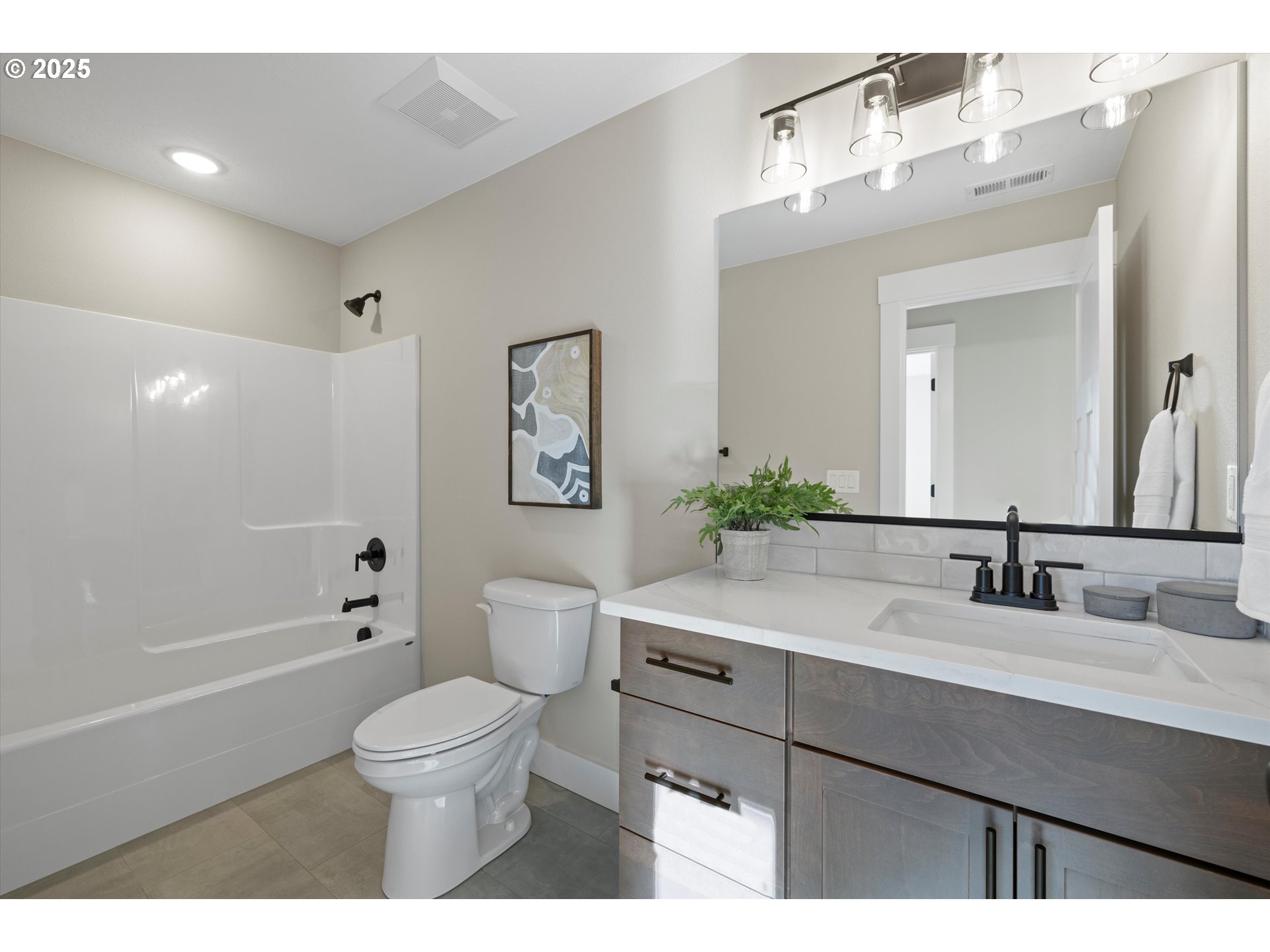 1801 Southwest 1st Street Pendleton, OR 97801 - Photo 24 of 29 a bathroom with a sink a toilet and a large mirror