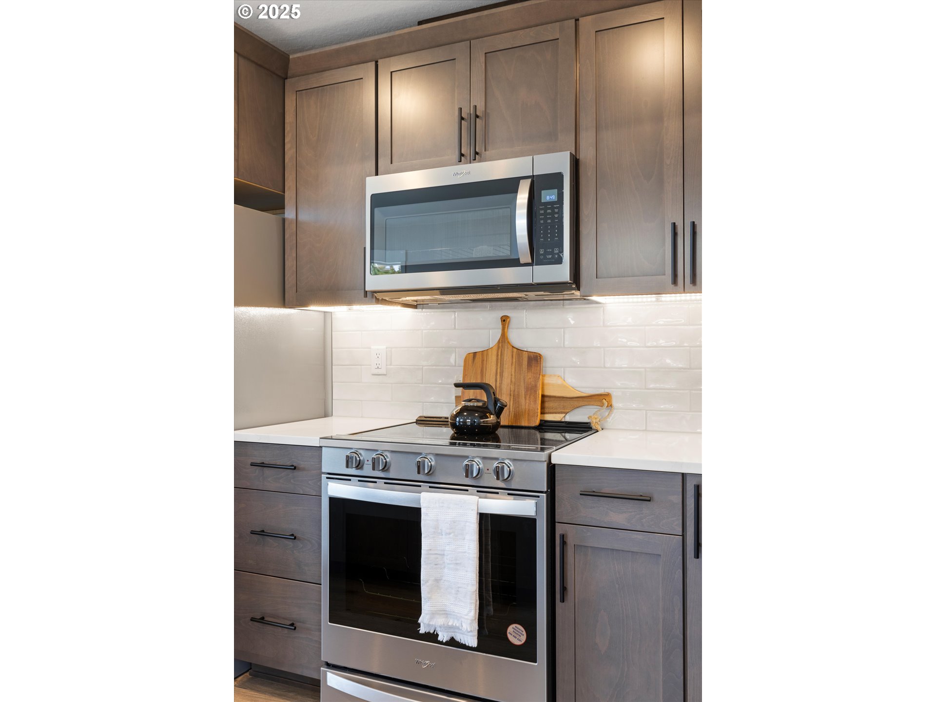 1801 Southwest 1st Street Pendleton, OR 97801 - Photo 10 of 29 a kitchen with stainless steel appliances granite countertop a stove and a microwave