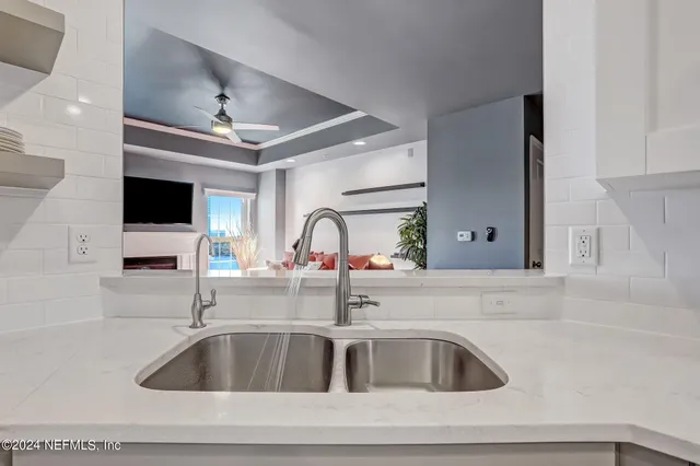 a bedroom with a bed and a chair