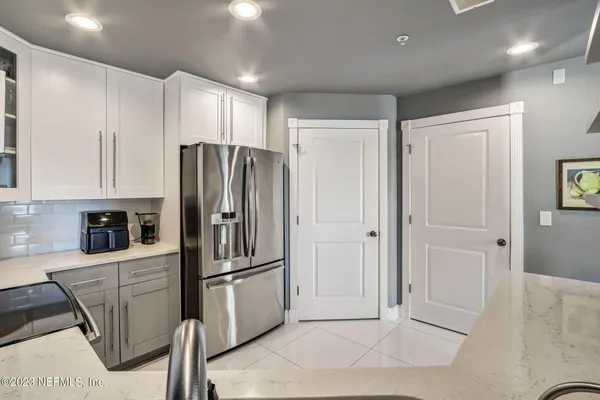 a bathroom with a shower and a mirror