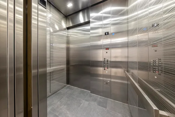 a view of a glass entrance door and windows