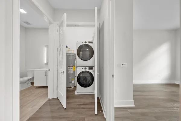 a view of a hallway with washer and dryer