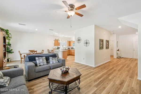a kitchen with stainless steel appliances granite countertop a refrigerator a sink a stove a microwave and island
