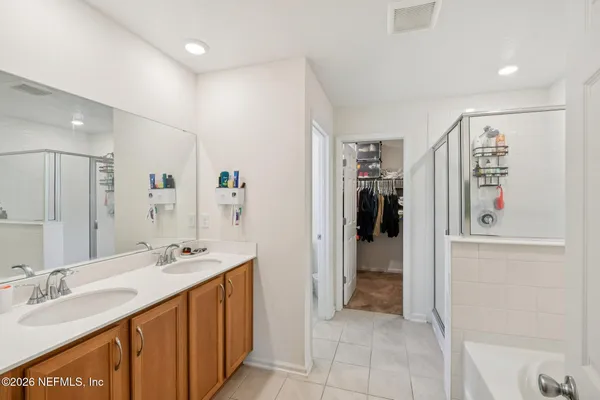 a bathroom with a bathtub and a shower