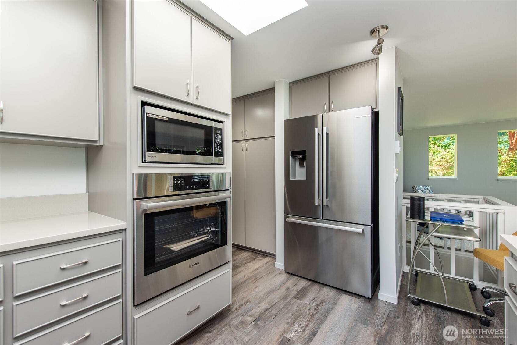 681 Bachelor Road Sequim, WA 98382 - Photo 17 of 39 a kitchen with stainless steel appliances and wooden floor