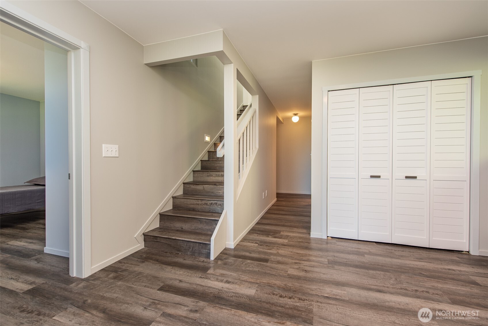 681 Bachelor Road Sequim, WA 98382 - Photo 20 of 39 a view of a hallway with wooden floor and entryway