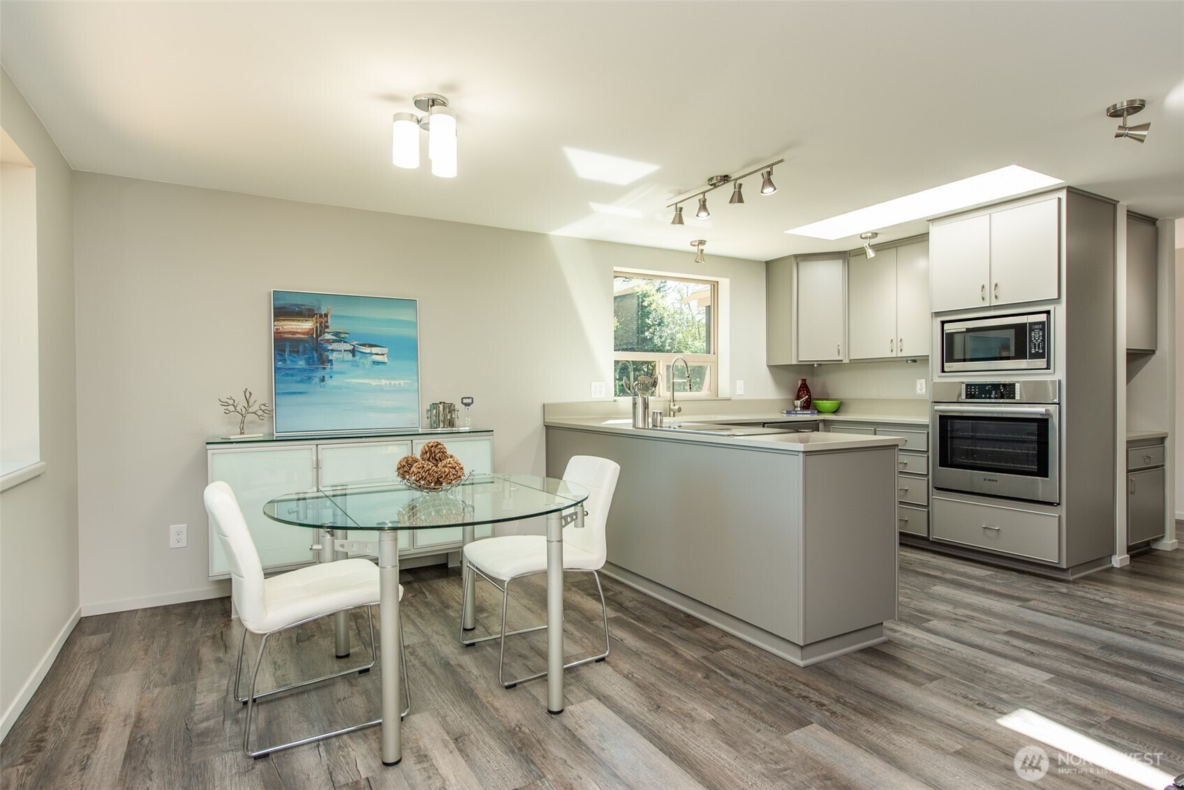 681 Bachelor Road Sequim, WA 98382 - Photo 7 of 39 a kitchen with a dining table chairs and refrigerator