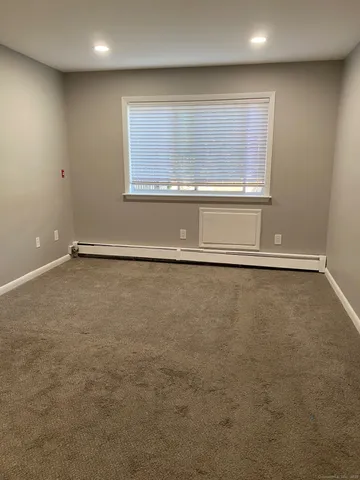 an empty room with a empty space and window