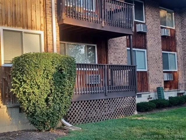 front view of a house with a garden