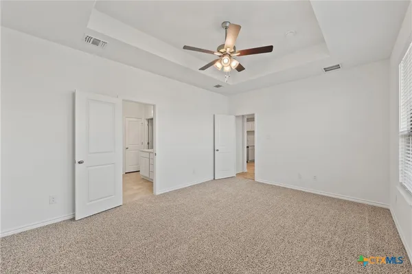 a spacious bathroom with a double vanity sink mirror and