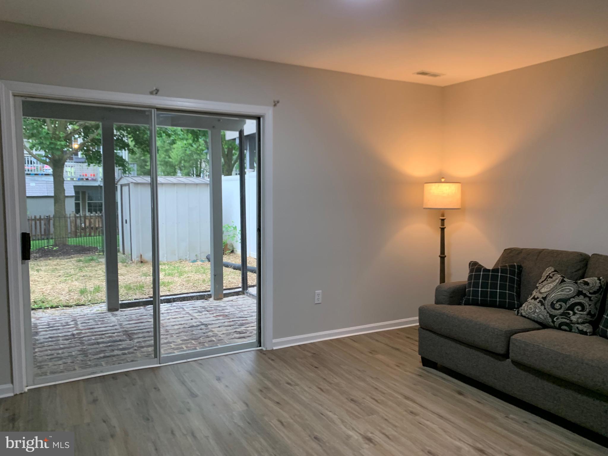 114 Sentry Ridge Smithsburg, MD 21783 - Photo 49 of 60 a living room with couch and a floor to ceiling window